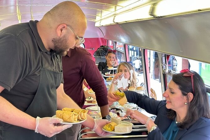 "Here We Go Again" London Afternoon Tea Bus - The London Eye and the riverfront view