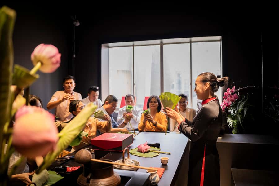 Ho Chi Minh City: Vietnamese Lotus Tea Culture Experience - Watching tea placed inside a fresh lotus bud