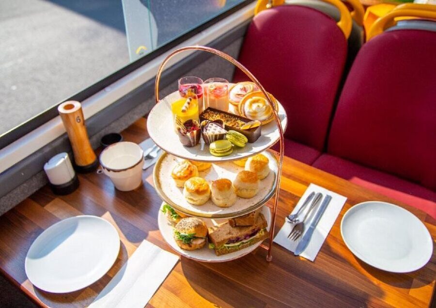 London: Afternoon Tea Bus with a Glass of Prosecco - A London bus ride with afternoon tea on the table