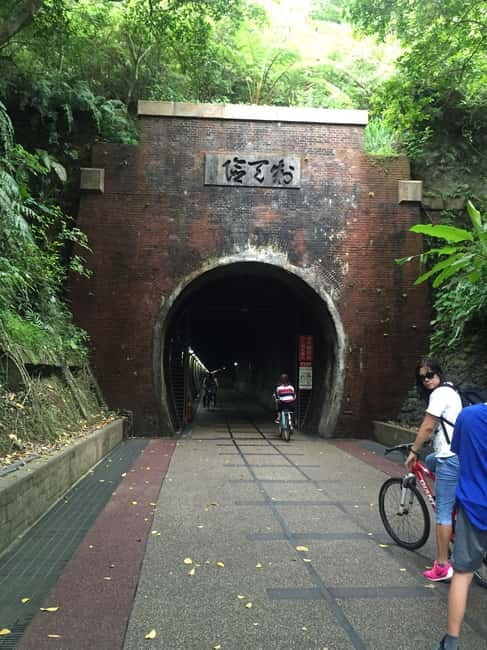 Taipei Private Spiritual Tour with Afternoon Tea & Cycling - The Old Caoling Tunnel ride adds movement and cool air