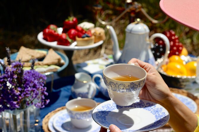 Tea By The Sea - A prepared tea table above Mitchell’s Cove Beach